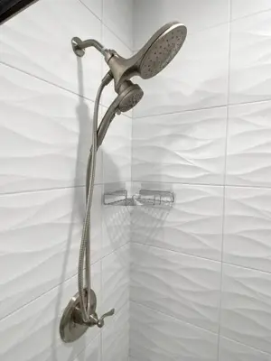 a shower with a shower head in a bathroom at ZANGO Explore OTR and Downtown from a Renovated Condo in Cincinnati