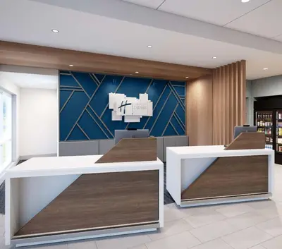 an office with two desks and a wall with a mural at Holiday Inn Express & Suites Lima by IHG in Lima