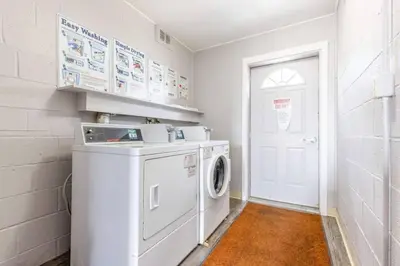 a washer and dryer in a white laundry room at Exclusive NEW Listing! Maple Heights Charm in Maple Heights