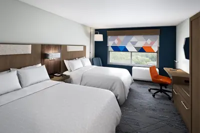 a hotel room with two beds and a window at Holiday Inn Express & Suites Columbus - New Albany by IHG in New Albany