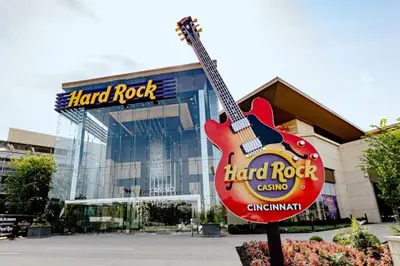 a large guitar sign in front of a hard rock building at Peaceful, Brand New Ranch Home in Trenton, OH in Trenton
