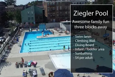 a large swimming pool with people in it at Cozy Apt in Walkable Area Downtown with Parking in Cincinnati