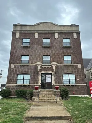 a large brick building with a front door and stairs at Central Loft with Pool Table! Pet-friendly Haven! in Columbus