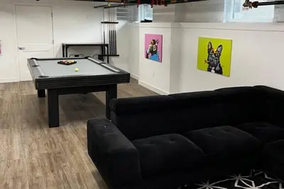 a living room with a pool table and a couch at Designer 1-Bed Haven near Downtown! Pets Welcome! in Columbus
