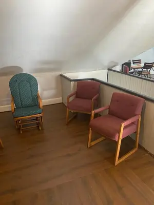 two chairs and a table in a room at Awesome Attic studio3B private room /shared apt in Cincinnati