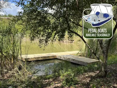 a sign for a pond with a boat on it at Block of 7 Lodges at Eden Reserve - For Groups in Williamstown