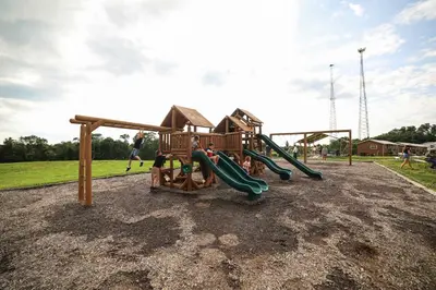 a park with a playground with a slide at The Lodges at Eden Reserve - Safari Tents in Williamstown