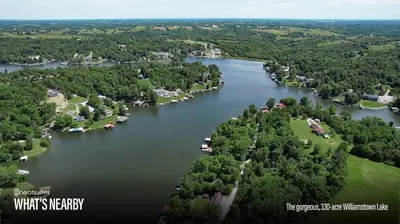 an aerial view of a lake with houses and trees at Home for 21 Near Ark - Ensuite Bathrooms - with Pool! in Williamstown