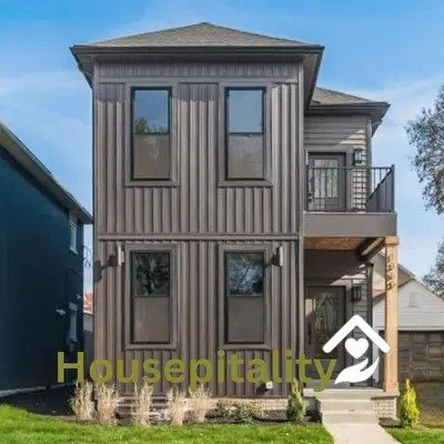 a home with a housepticility sign in front of it at Stylish 4BR in Merion Village PD in Columbus