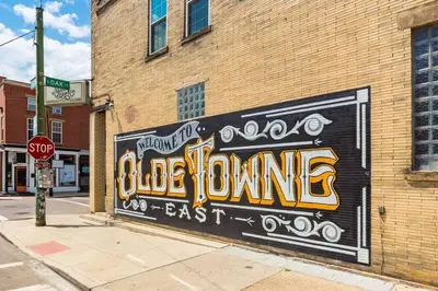 a mural on the side of a brick building at Columbus Gem with Pool Table! Pets Welcome! in Columbus