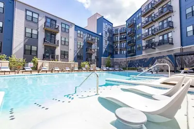 a swimming pool with a slide in a apartment complex at 2 Stylish apartments near shops and entertainment in Cincinnati