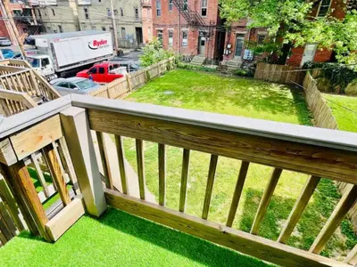 a view of a yard from a balcony at Jungle House Luxury Stays - Columbus Downtown Short North in Columbus