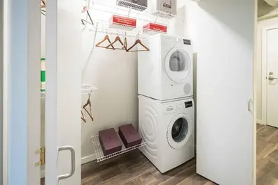 a laundry room with a washer and dryer at 2 Studios apartment w prime location in Cleveland