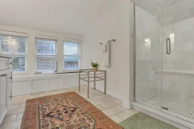 a bathroom with a shower and a glass shower stall at The Goodale House - 2 Units - 4 BR 5 Bath in Columbus