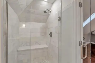 a bathroom with a shower with a glass door at The Goodale House - 2 Units - 4 BR 5 Bath in Columbus