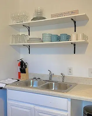a kitchen counter with a sink and shelves at Dayton with 6 Beds Sleeps 8 4 Bedrooms plus WIFI in Dayton