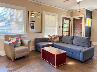 a living room with a blue couch and two chairs at Sleeps up to 20 in Dayton with 6 Bedrooms plus 2 Full Kitchens in Dayton