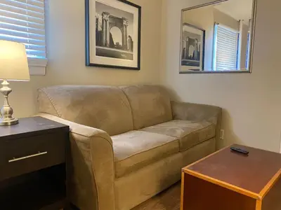 a living room with a couch and a table at Crew Housing Sleeps 8 with 6 Beds plus 4 Bedrooms in Dayton
