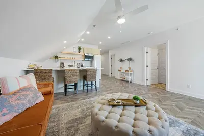 a living room with a couch and a table at The Washington Downtown Boutique Hotel in Sandusky