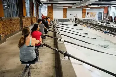 a group of people in a factory working on chickens at Cute 1Bed Loft at The Foundry - Steps to Riverside in Cleveland