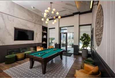 a living room with a pool table and a tv at Cozy 10BR 10BA combined Apartment Near Downtown Cincinnati in Cincinnati