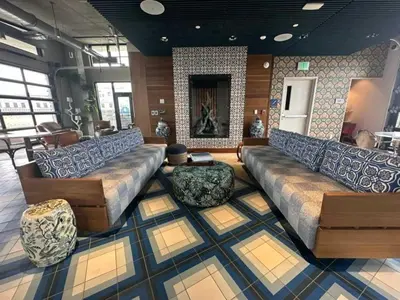 a large living room with couches and a fireplace at Brand new 2BR 3BA combined apartments with city views in Cleveland
