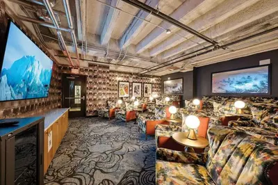 a large living room with a large screen tv at 7 Brand new combined apartments with city views in Cleveland