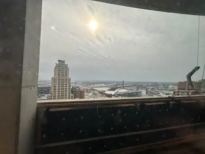 a view of a city from a window at 7 Brand new combined apartments with city views in Cleveland