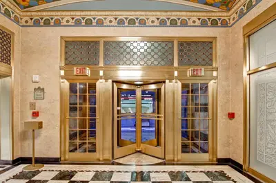 a lobby with a gold door in a building at Homewood Suites by Hilton Cincinnati-Downtown in Cincinnati