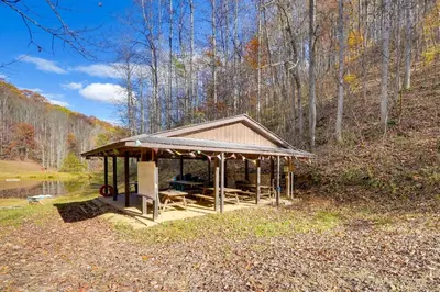 a gazebo on the side of a pond at Shared Pond at Retreat in Rosedale! in Rosedale