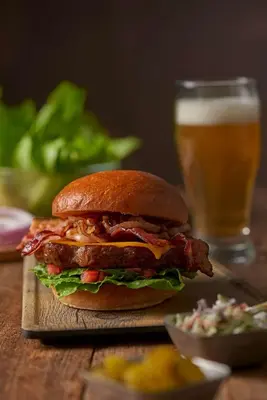 a sandwich on a table with a glass of beer at Hyatt Place Columbus/OSU in Columbus