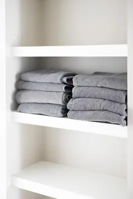 a stack of towels in a closet at Luxury Downtown Townhome Private Garage Unit 3 in Cleveland