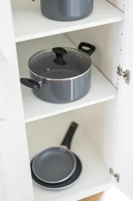 a pot and pan on a shelf in a kitchen at Luxury Downtown Townhome Private Garage Unit 4 in Cleveland