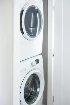 a washing machine and a dryer in a room at Luxury Downtown Townhome Private Garage Unit 6 in Cleveland