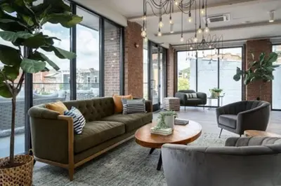 a living room with a couch and a table at OTR King Bed Free On Site Parking Gym Pool Club Room in Cincinnati