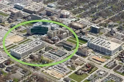 a green circle in a city with buildings at Cle Suites 3BR 2BA 5 min Walk to Cle Clinic Unit 1 in Cleveland
