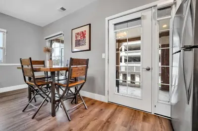 a dining room with a table and chairs at Cle Suites 2BR 1BA 5 min Walk to Cle Clinic #8 in Cleveland