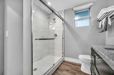 a bathroom with a shower and a toilet at Cle Suites 1BR 1BA 5 min Walk to Cle Clinic #11 in Cleveland