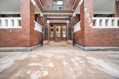 a brick building with a door on the side of it at Cle Suites 2BR 1BA 5 min Walk to Cle Clinic #12 in Cleveland
