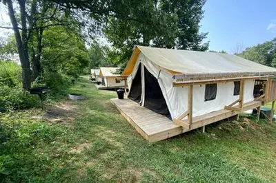 a large white tent sitting in a field at Breathtaking Family Friendly Tented Cabin in Logan, Ohio in Logan