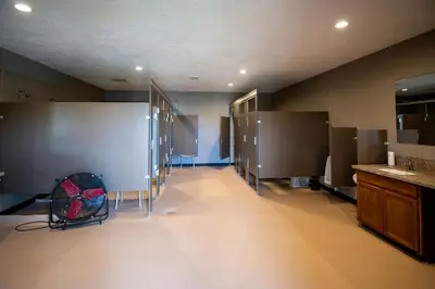 a large room with stalls in a bathroom at Breathtaking Family Friendly Tented Cabin in Logan, Ohio in Logan