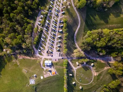 an aerial view of a parking lot with parked cars at Beautiful Tented Cabin Nestled Amidst Trees with Incredible Hiking Trails Near in Logan, Ohio in Logan