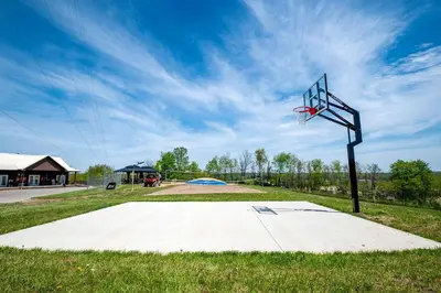a basketball hoop in the middle of a park at Charming Tented Cabin Placed in a Selcuded Area in Logan, Ohio in Logan