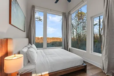 a bedroom with a bed and large windows at Adamina Canyon Luxurious, Canyon View 5BR,3BTH in Rockbridge