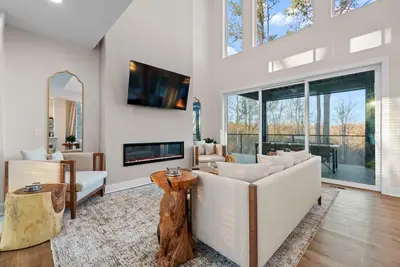 a living room with white furniture and a large window at Adamina Canyon Luxurious, Canyon View 5BR, 3BTH 1 in Rockbridge