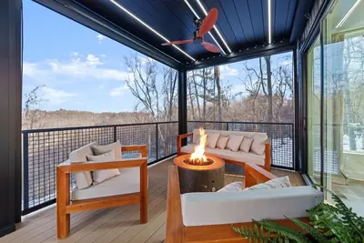 a screened in porch with a fire pit on a deck at Adamina Canyon Luxurious, Canyon View 5BR, 3BTH 1 in Rockbridge