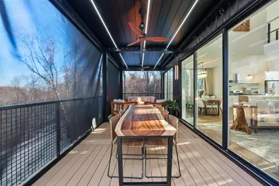 a large deck with a wooden table on a balcony at Adamina Canyon Luxurious, Canyon View 5BR 3BTH- 6 in Rockbridge