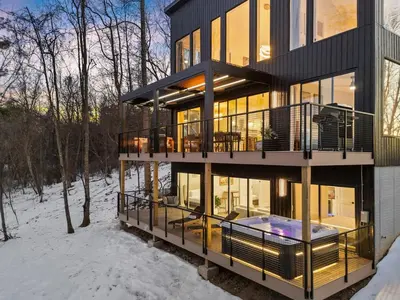 a large house with a deck in the snow at Adamina Canyon Luxurious, Brand New 5BR 3BTH 7 in Rockbridge