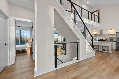 a staircase in a house with a living room at Adamina Canyon Luxurious, Brand New 5BR 3BTH 7 in Rockbridge