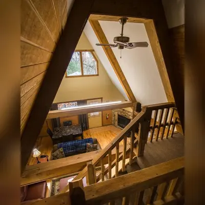 an overhead view of a living room with a ceiling at A-Frame #09 - by The Chalets in Logan